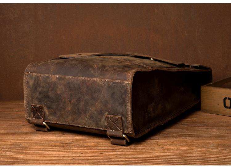 Vintage Leather Backpack in distressed brown leather with a rugged, worn finish and secure buckled flap closure