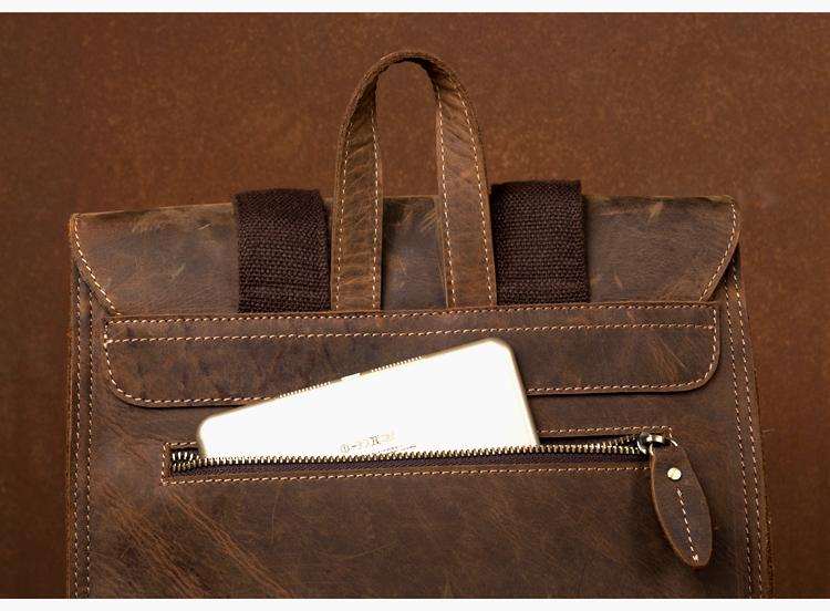 Vintage Leather Backpack in distressed brown leather with a briefcase-style flap, top handle, and front zip pocket