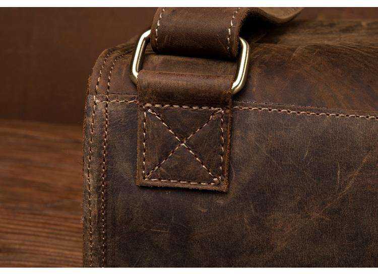 Vintage Leather Backpack in dark brown Crazy Horse leather, with rugged texture and reinforced cross-stitched strap detail