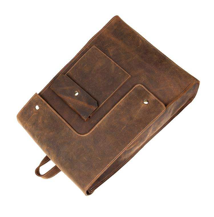 Vintage Leather Backpack in brown Crazy Horse leather with flap pockets, snap closures and a structured briefcase design