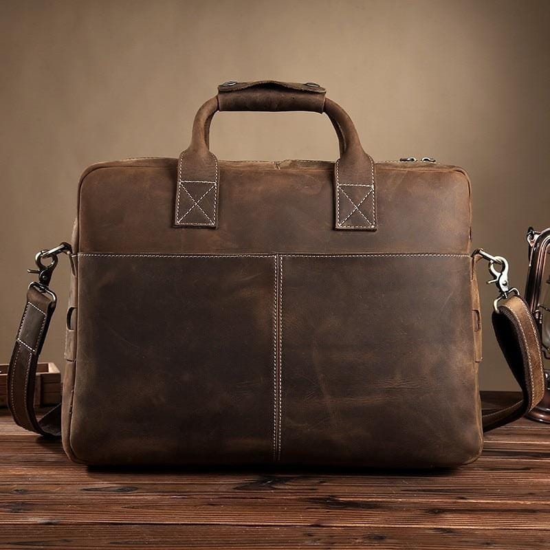 Vintage Welch Briefcase made of premium crazy horse leather with adjustable shoulder strap and multiple compartments for laptops up to 15 inches