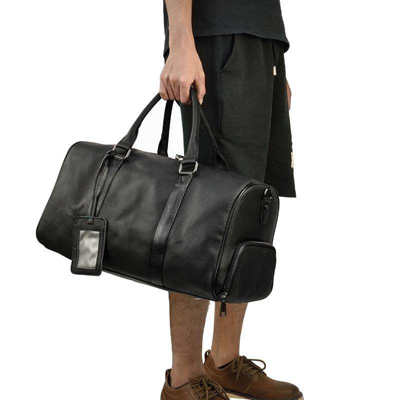 Endre Weekender Leather Duffle Bag in black premium leather with adjustable shoulder strap and multiple compartments for travel and everyday use