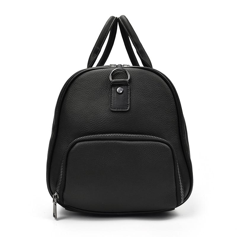 Endre Weekender leather duffle bag in black with adjustable strap and multiple compartments for travel and work