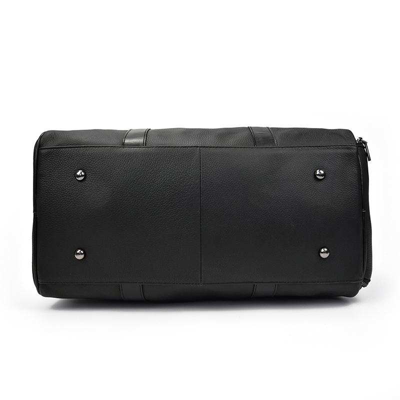 Black Endre Weekender leather duffle bag with adjustable shoulder strap and top handle for travel and work use