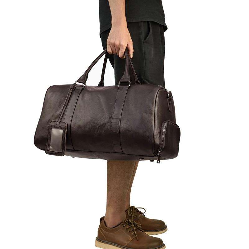 Endre Weekender leather duffle bag in black with adjustable shoulder strap and spacious compartments