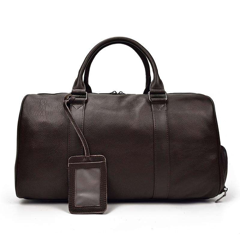 Endre Weekender black leather duffle bag with adjustable shoulder strap and multiple compartments for travel and daily use