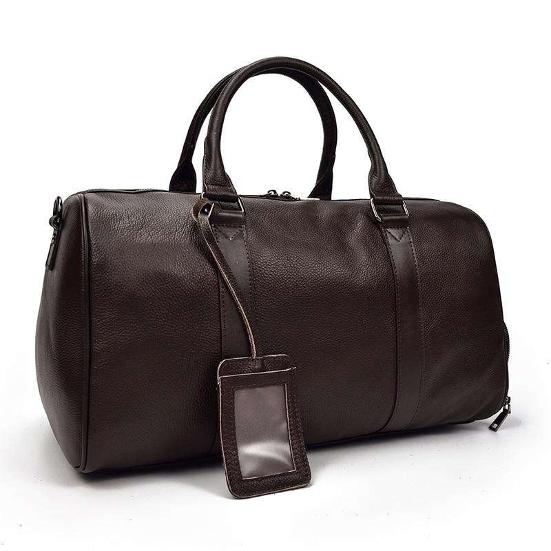 Endre Weekender Leather Duffle Bag in black leather with adjustable shoulder strap and durable design for travel and work