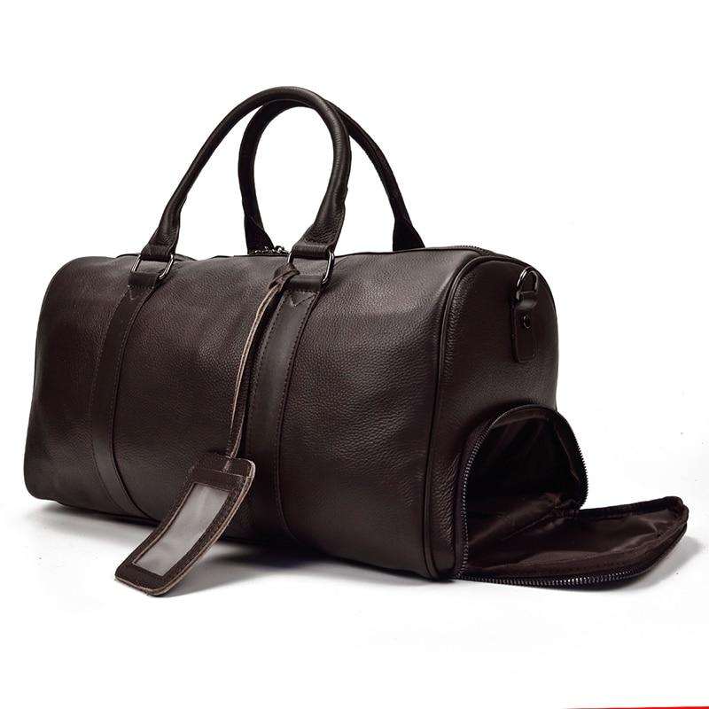 Endre Weekender Leather Duffle Bag in black premium leather with adjustable shoulder strap and multiple compartments for travel and work