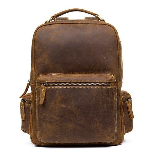 The Langley Genuine Leather Backpack in vintage brown crazy horse leather showcasing front, side, and back pockets with adjustable straps and grab handle