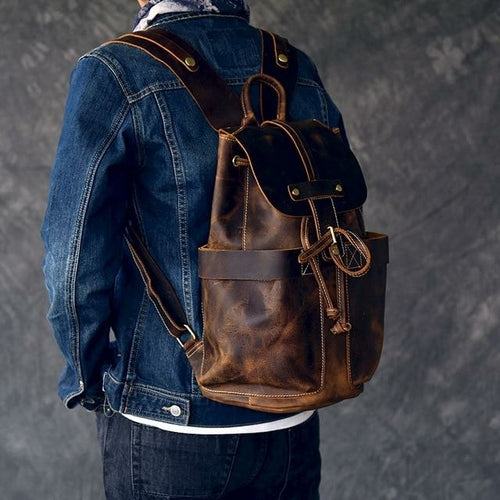 The Olaf Leather Travel Backpack vintage brown leather rucksack with dual front pockets and adjustable straps