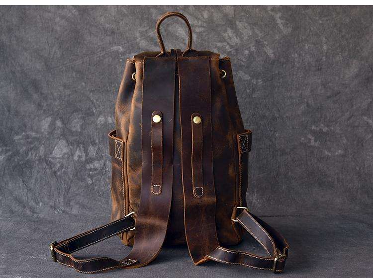 Vintage Olaf Leather Travel Backpack in brown crazy horse leather with dual front pockets and adjustable straps